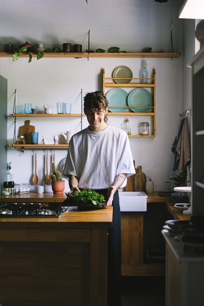 services-img A person smiles while preparing fresh ingredients in a cozy kitchen.